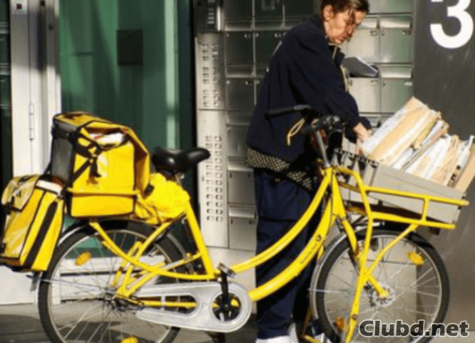 Gelbes Briefträger Fahrrad - Bild